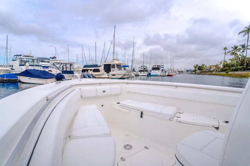 Slide: The Image of 2020 Sea Prop center console boat docked in a marina with other vessels. - 17