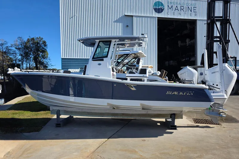 The Image of 2026 Blackfin 262 HB boat displayed at a marine center. - 1