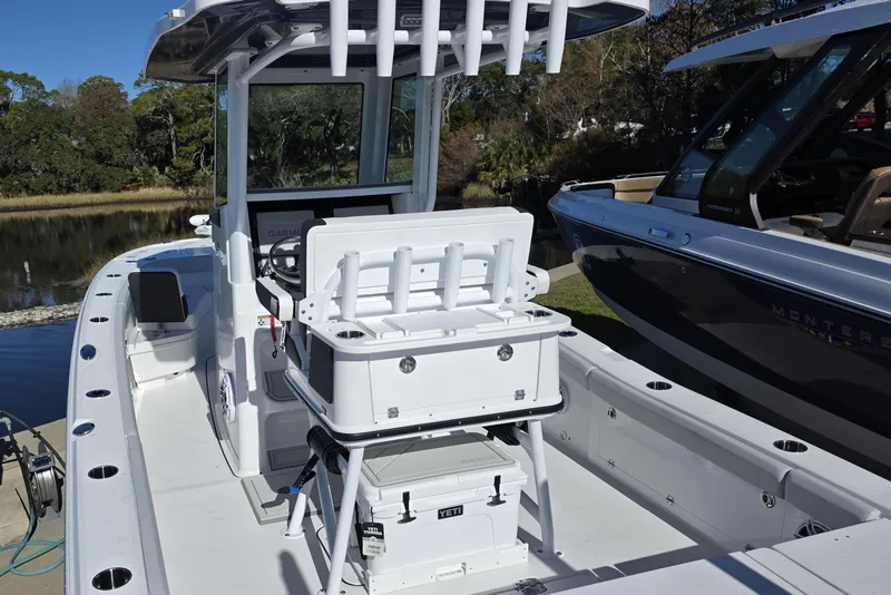 Slide: The Image of 2026 Blackfin 262 HB boat interior with fishing rod holders and seating. - 7