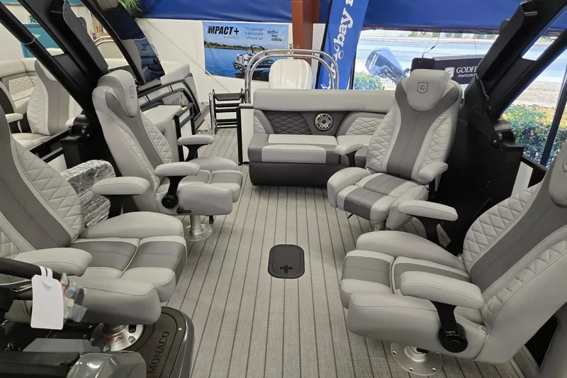 Slide: The Image of Luxurious interior of 2026 Godfrey Monaco 235 QSB pontoon boat with plush seating. - 12