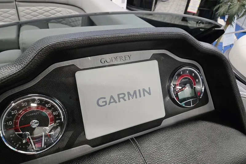 Slide: The Image of Dashboard of 2026 Godfrey Monaco 235 QSB with Garmin display and gauges. - 16