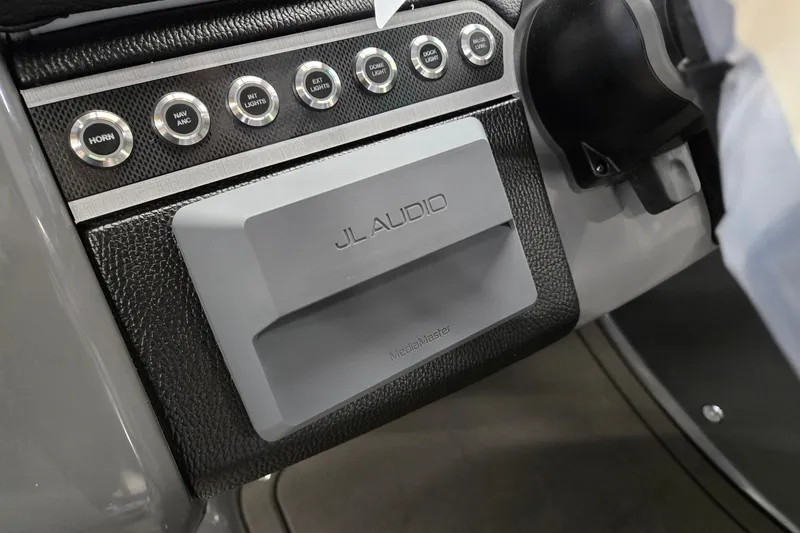 Slide: The Image of Control panel of 2026 Godfrey Monaco 235 QSB with JL Audio system. - 17