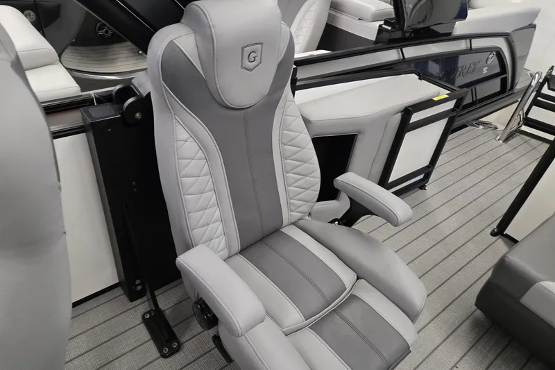 Slide: The Image of Luxurious seating on 2026 Godfrey Monaco 235 QSB boat, featuring elegant gray upholstery. - 23