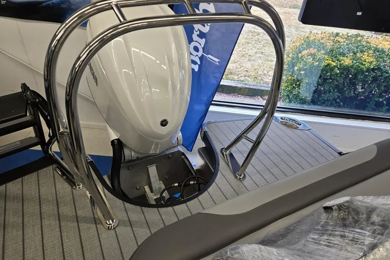 Slide: The Image of 2026 Godfrey Monaco 235 QSB boat with sleek design and modern features. - 25