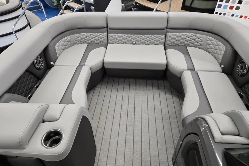 Slide: The Image of Luxurious seating on 2026 Godfrey Monaco 235 QSB pontoon boat, featuring elegant gray upholstery. - 34