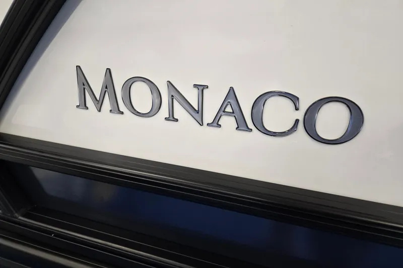 Slide: The Image of Monaco 235 QSB logo on 2026 Godfrey boat, sleek design detail. - 35