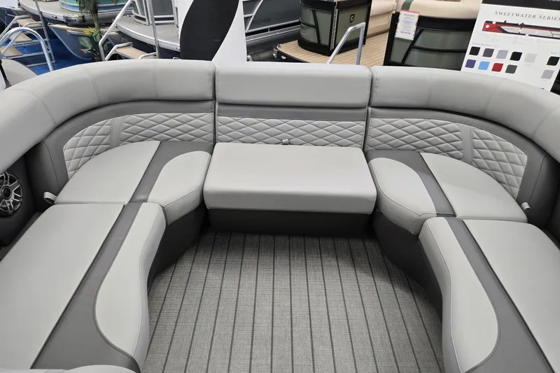 Slide: The Image of Luxurious seating on 2026 Godfrey Monaco 235 QSB pontoon boat, featuring elegant gray upholstery. - 8