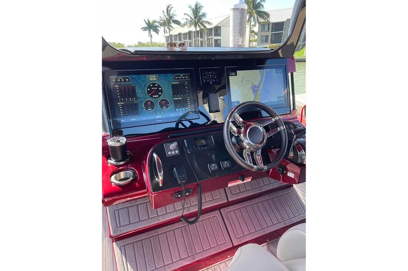 Slide: The Image of 2021 Mystic Powerboats M3800 dashboard with advanced navigation screens and controls. - 11