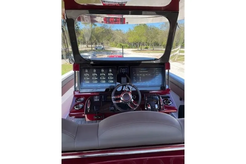 Slide: The Image of 2021 Mystic Powerboats M3800 dashboard with advanced navigation and control systems. - 12