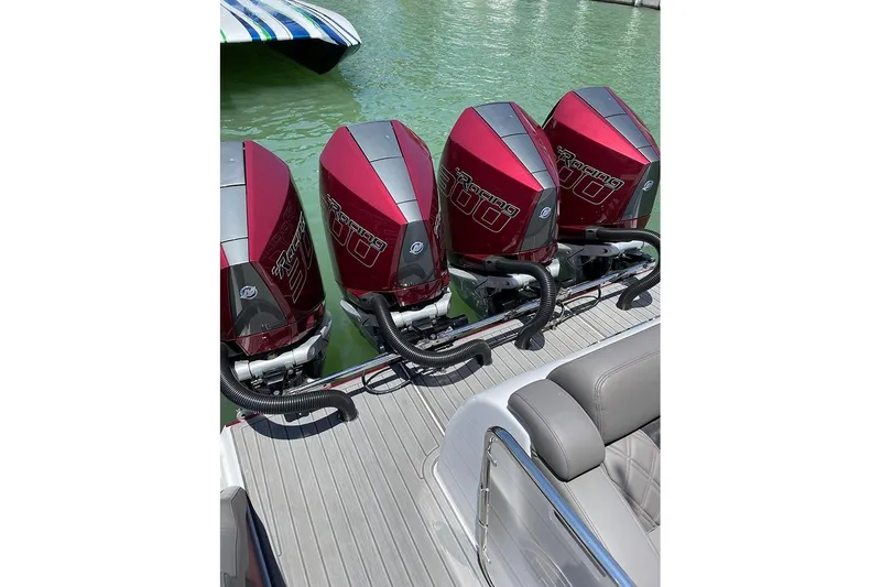 Slide: The Image of 2021 Mystic Powerboats M3800 with four red Mercury Racing outboard engines. - 16