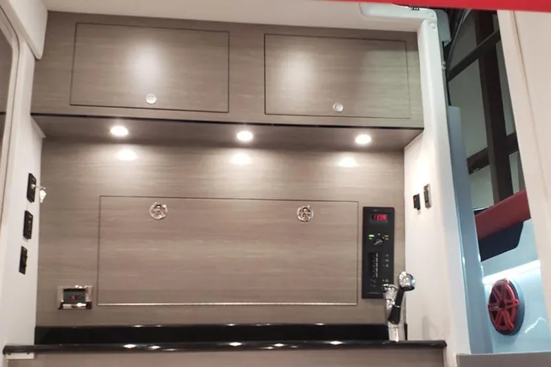 Slide: The Image of Manufacturer Provided Image: Interior of 2021 Mystic Powerboats M3800, featuring modern cabinetry and sleek design. - 27