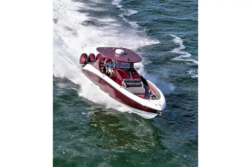 Slide: The Image of 2021 Mystic Powerboats M3800 speeding on open water, showcasing sleek design and powerful performance. - 8