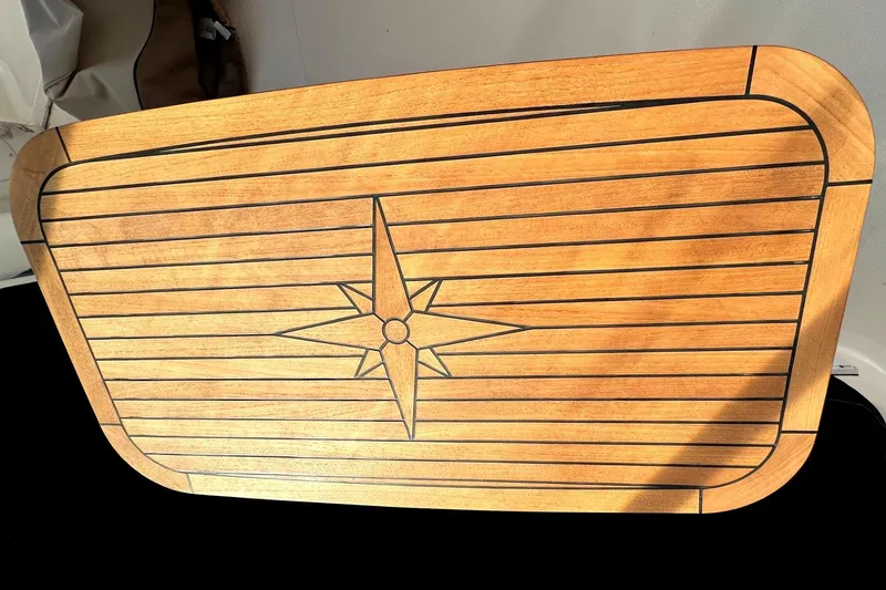 Slide: The Image of Teak table with compass rose design on 2004 Meridian 459 Motoryacht. - 18