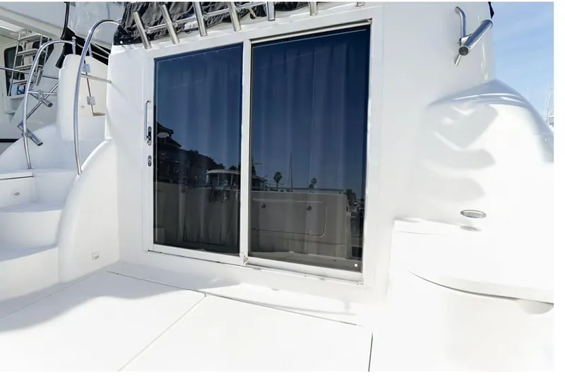 Slide: The Image of 2004 Meridian 459 Motoryacht with sliding glass doors and white deck. - 21