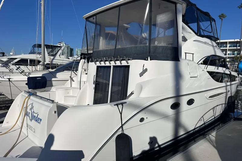 Slide: The Image of 2004 Meridian 459 Motoryacht docked at marina under clear blue sky. - 3