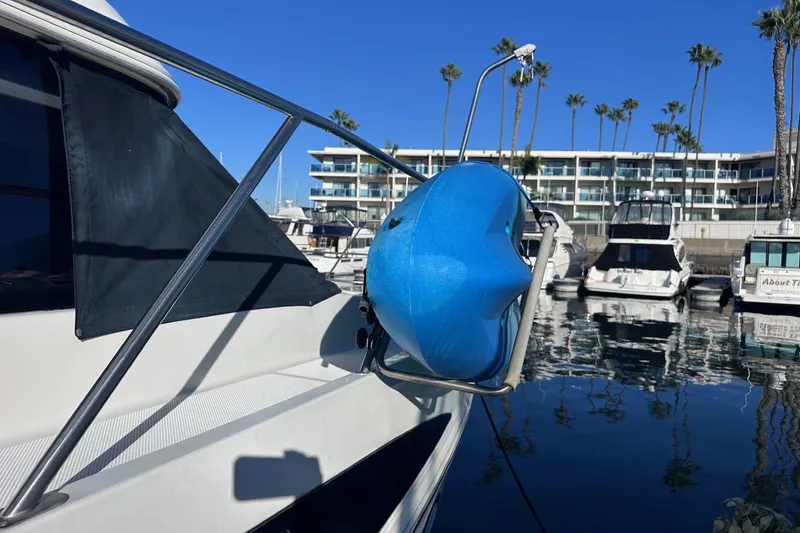 Slide: The Image of 2004 Meridian 459 Motoryacht docked with blue fender, marina background. - 4