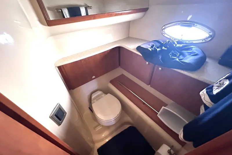 Slide: The Image of Bathroom interior of 2004 Meridian 459 Motoryacht with wooden cabinetry and porthole window. - 8