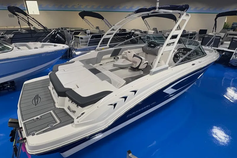 Slide: The Image of 2020 Chaparral 23 SSi boat with sleek design in showroom setting. - 3