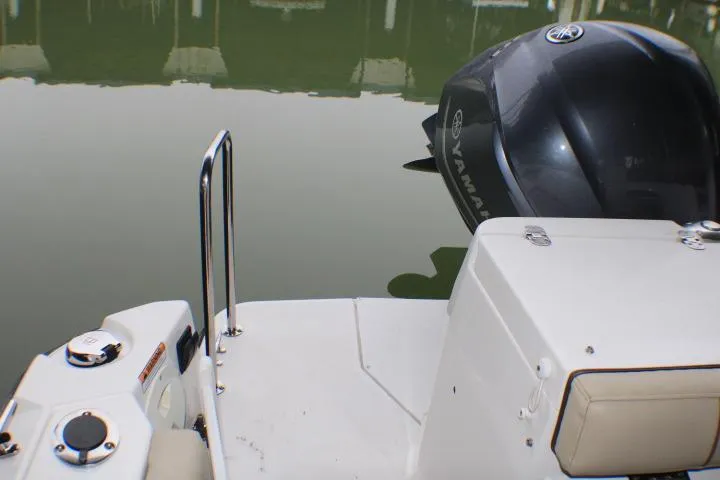 Slide: The Image of 2020 Ranger Tugs R-27 boat stern with Yamaha outboard motor. - 12