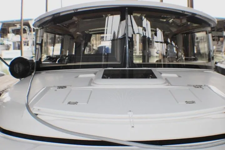 Slide: The Image of 2020 Ranger Tugs R-27 boat with sleek design and spacious deck. - 13