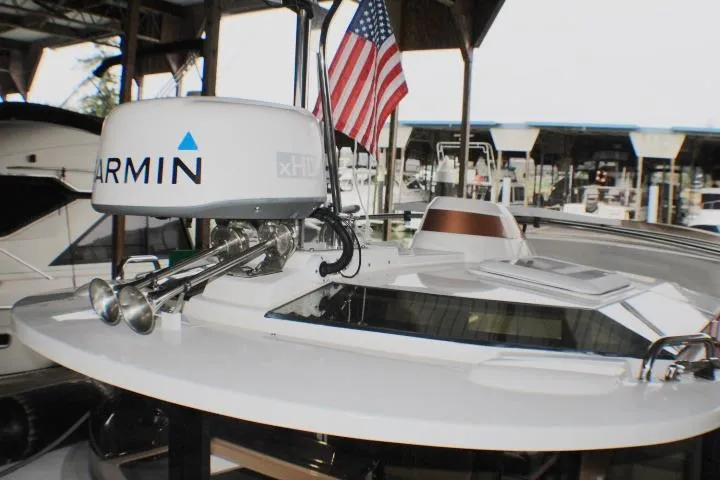 Slide: The Image of 2020 Ranger Tugs R-27 boat with Garmin radar and American flag at marina. - 14
