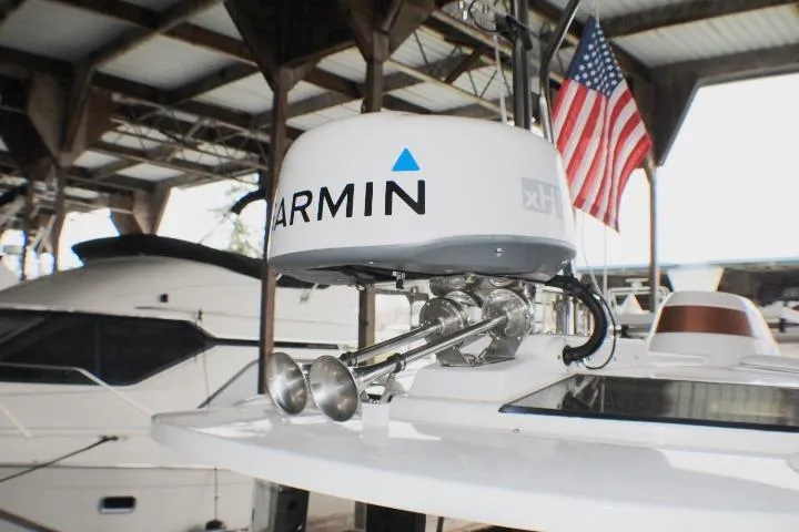 Slide: The Image of 2020 Ranger Tugs R-27 with Garmin radar and American flag in marina. - 15