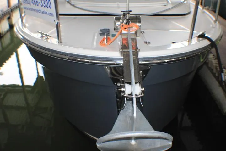 Slide: The Image of 2020 Ranger Tugs R-27 boat bow with anchor in marina setting. - 17