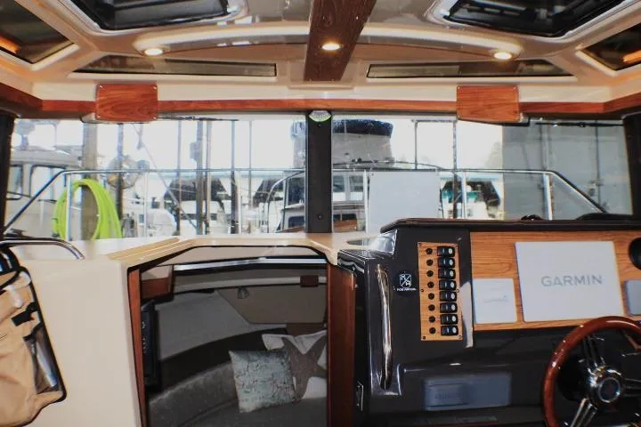 Slide: The Image of Interior view of 2020 Ranger Tugs R-27 boat with Garmin navigation system. - 45