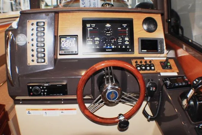 Slide: The Image of 2020 Ranger Tugs R-27 helm with advanced navigation and control systems. - 47