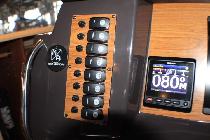 Slide: The Image of Control panel of 2020 Ranger Tugs R-27 with switches and Garmin display. - 51