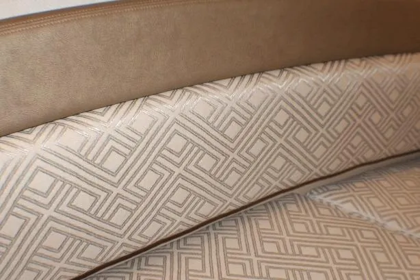 Slide: The Image of 2020 Ranger Tugs R-27 interior with geometric-patterned upholstery and leather trim. - 79