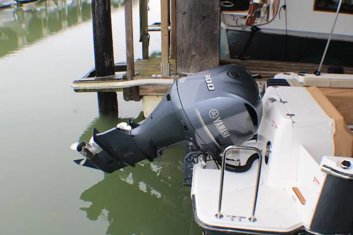 Slide: The Image of 2020 Ranger Tugs R-27 with Yamaha 300 outboard motor docked at marina. - 9