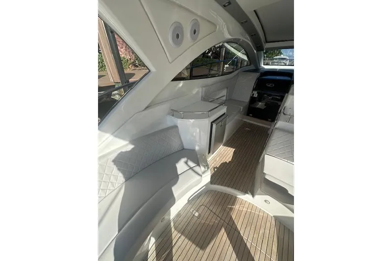 Slide: The Image of Interior of 2023 Schaefer 400 yacht with modern seating and wood flooring. - 26