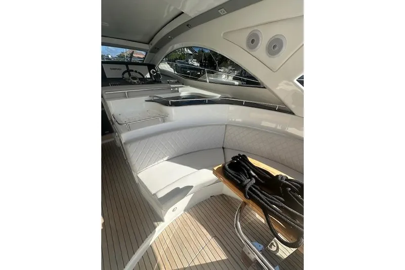 Slide: The Image of Luxurious interior of 2023 Schaefer 400 yacht with elegant seating and wooden accents. - 27