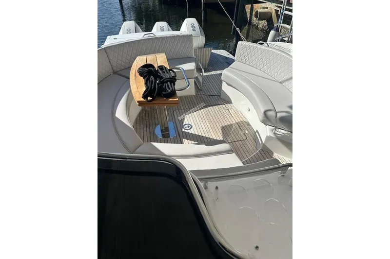 Slide: The Image of 2023 Schaefer 400 yacht deck with seating, table, and nautical rope. - 28