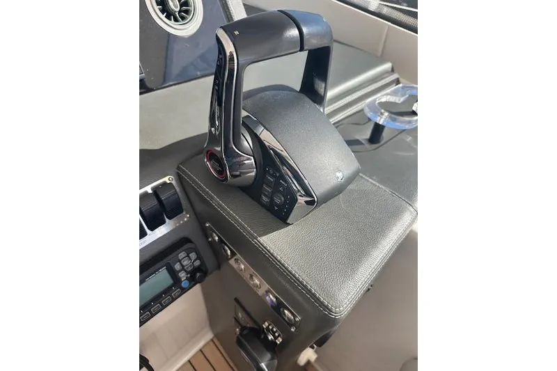 Slide: The Image of Throttle control on a 2023 Schaefer 400 yacht dashboard, featuring modern design and controls. - 31
