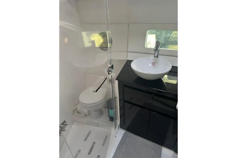 Slide: The Image of Modern bathroom in 2023 Schaefer 400 yacht with sleek fixtures and glass shower. - 39