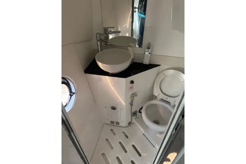 Slide: The Image of Modern Schaefer 400 yacht bathroom with sink, toilet, and porthole, 2023 model. - 42