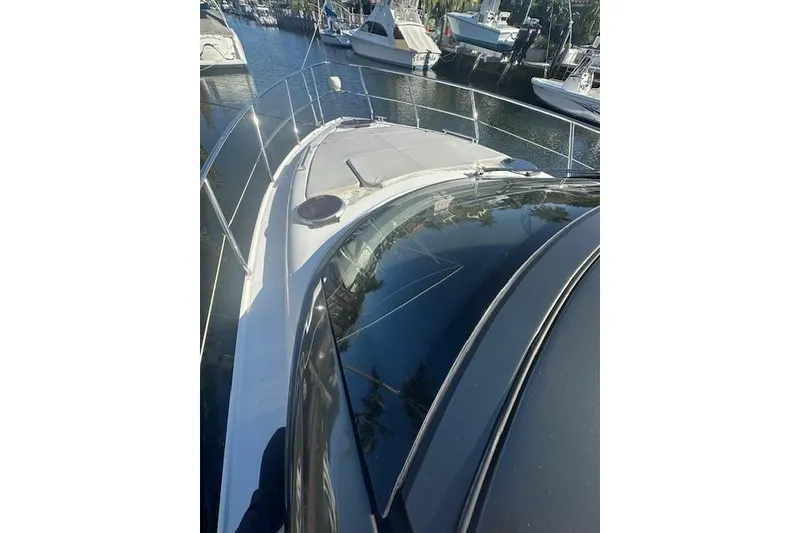 Slide: The Image of 2023 Schaefer 400 yacht docked at marina, sleek design and modern features. - 53