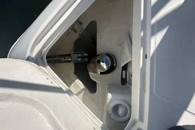 Slide: The Image of Anchor compartment of 2023 Schaefer 400 yacht, featuring a polished metal winch. - 56