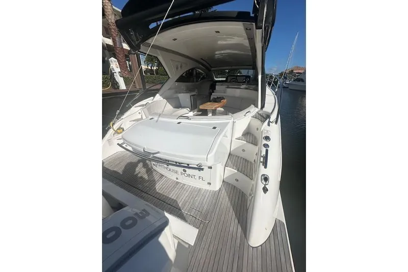 Slide: The Image of 2023 Schaefer 400 yacht docked, featuring spacious deck and modern design. - 57