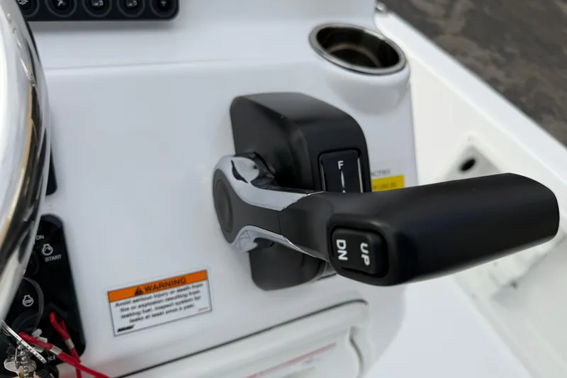 Slide: The Image of Throttle control of 2026 Blazer PureBay 2200 boat, featuring ergonomic design and warning label. - 16
