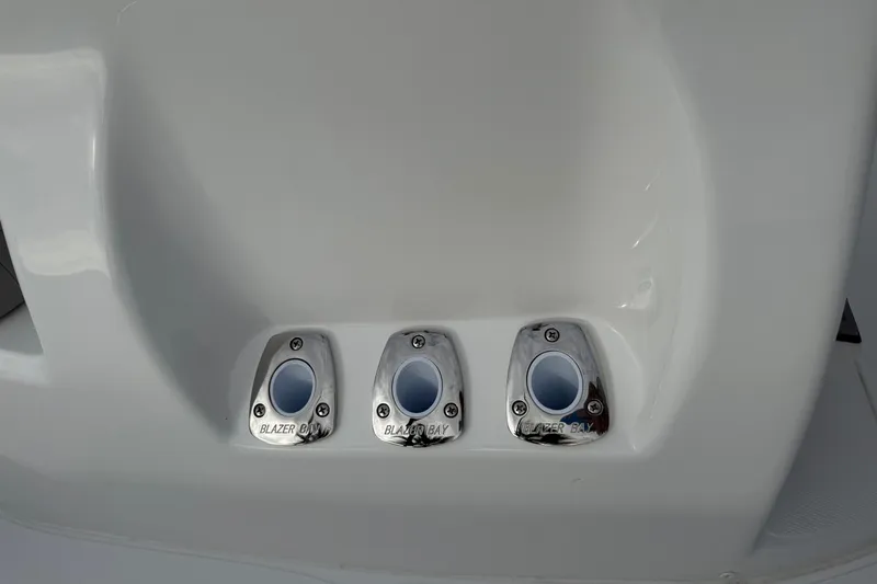 Slide: The Image of 2026 Blazer PureBay 2200 boat fittings, featuring three stainless steel outlets. - 24