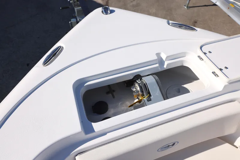 Slide: The Image of 2026 Sea Hunt Ultra 245 SE boat anchor compartment detail. - 13
