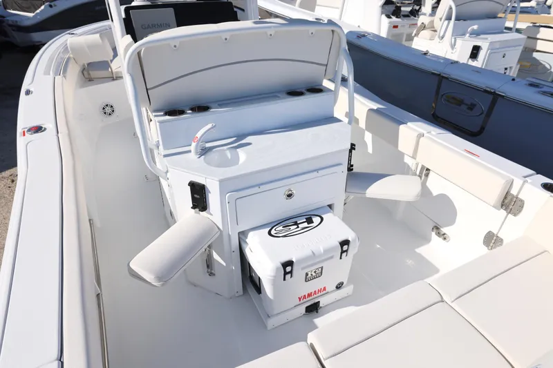 Slide: The Image of 2026 Sea Hunt Ultra 245 SE boat interior with seating and storage features. - 20