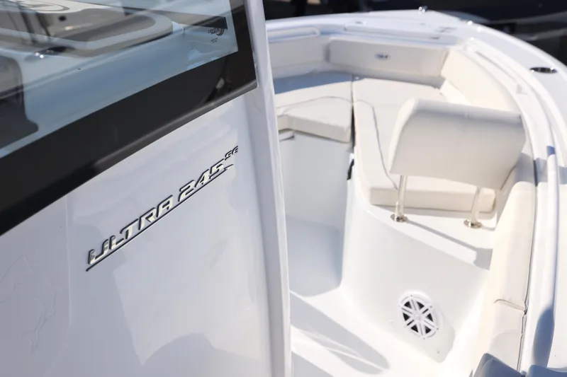 Slide: The Image of 2026 Sea Hunt Ultra 245 SE boat interior with seating and branding detail. - 23
