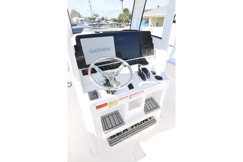 Slide: The Image of 2026 Sea Hunt Ultra 245 SE boat console with Garmin navigation system. - 3