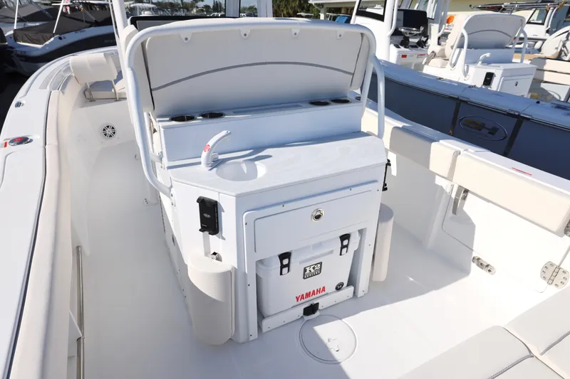 Slide: The Image of 2026 Sea Hunt Ultra 245 SE boat interior with seating and storage features. - 4