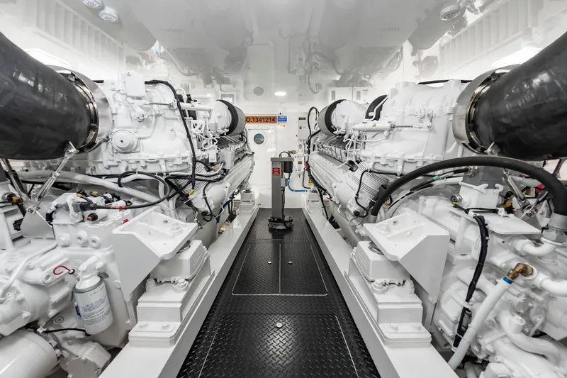 Slide: The Image of Engine room of 2024 Viking 72 Convertible yacht, showcasing powerful dual engines. - 100