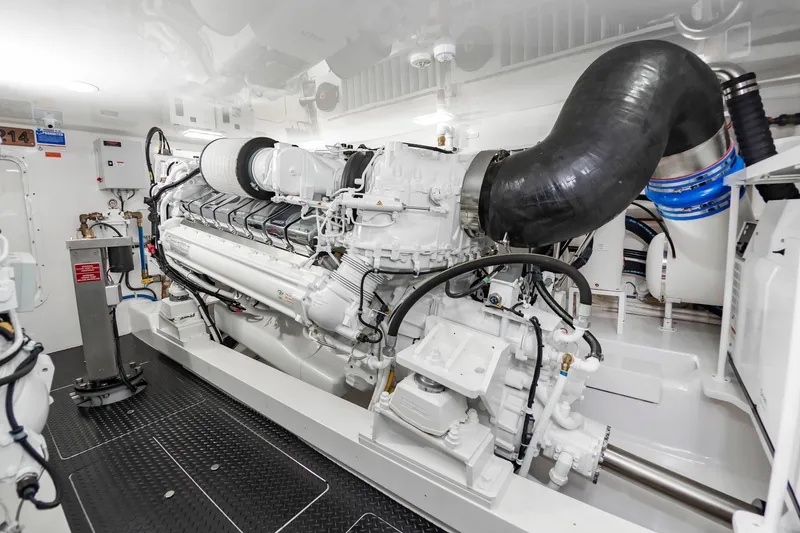 Slide: The Image of Engine room of 2024 Viking 72 Convertible yacht, showcasing advanced machinery and components. - 101